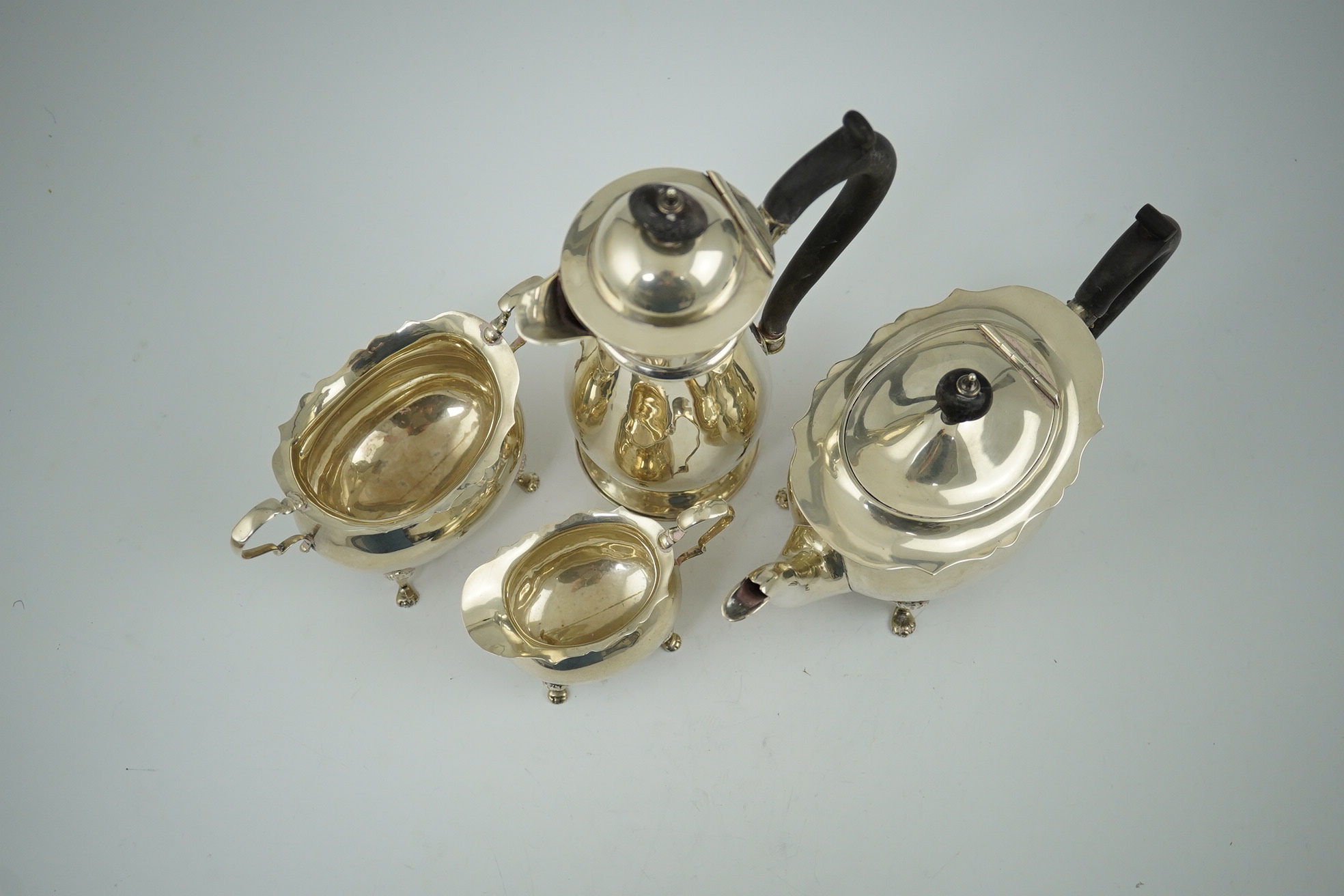 A late Victorian silver four piece tea set by Walker & Hall